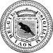 A black, circular seal with a notched, outer border. The center contains a shield or crest with a crown atop it. In the shield is a beaver. Surrounding the shield are the words