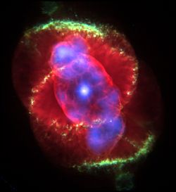 An object resembling a red eye, with a blue pupil, red-blue iris and a green brow. Another green