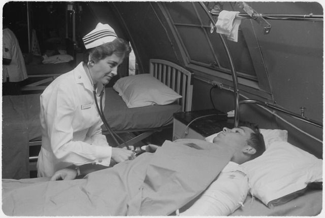 File:Da Nang, South Vietnam...United States Navy nurse Lieutenant Commander Joan Brouilette checks the condition of Pfc.... - NARA - 558531.tif