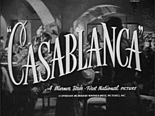 Black-and-white film screenshot with the title of the film in fancy font. Below it is the text